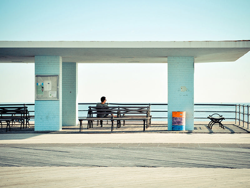 Pier-fotografie met eenzame bank