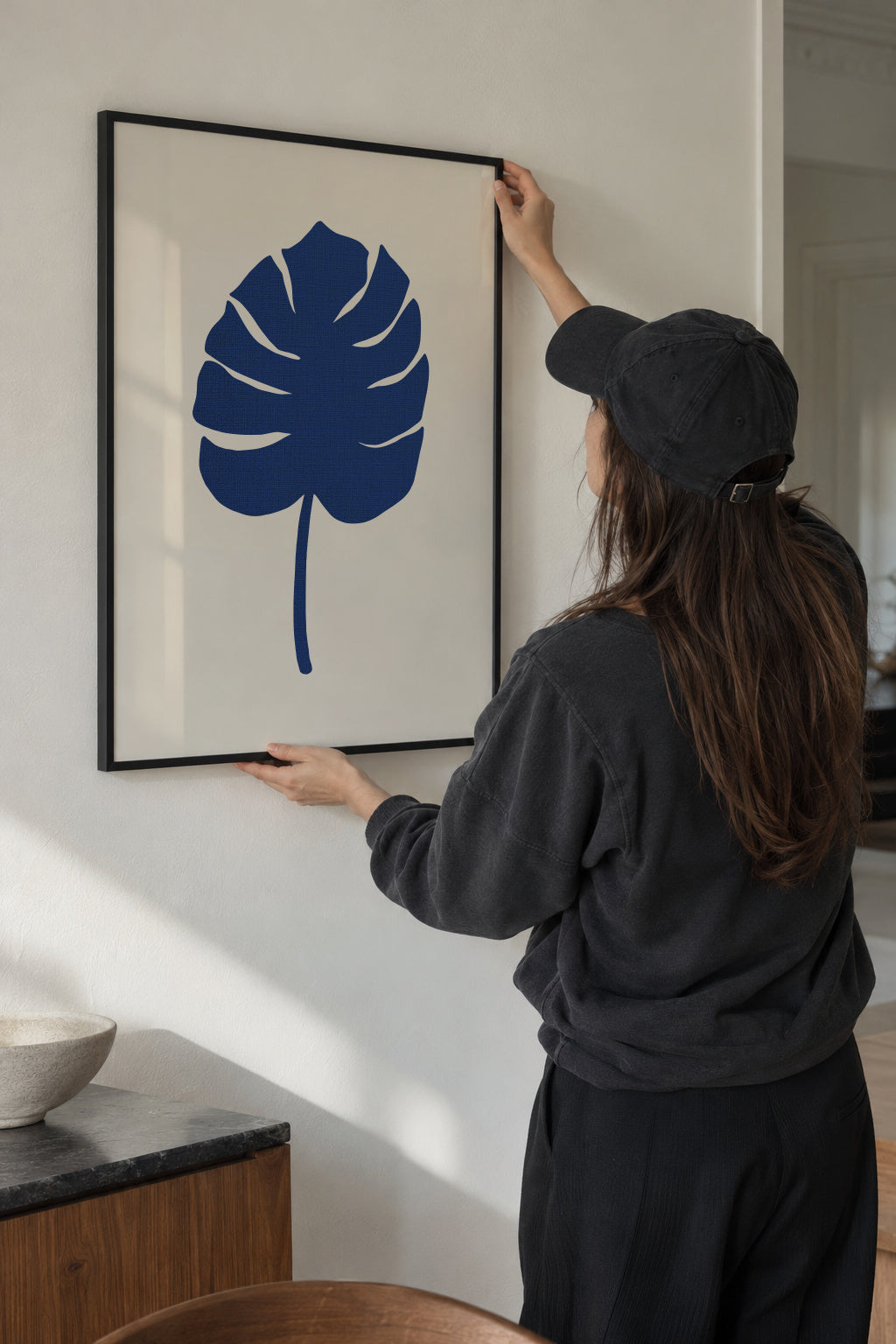 Monstera Canvas Blue - Framed poster in an interior