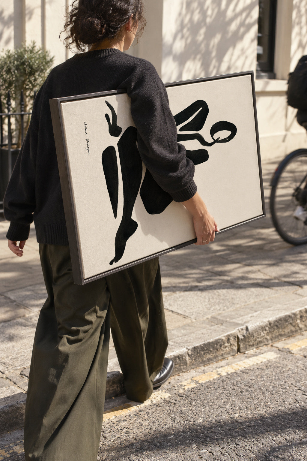Black figure #6 - Framed canvas in an interior