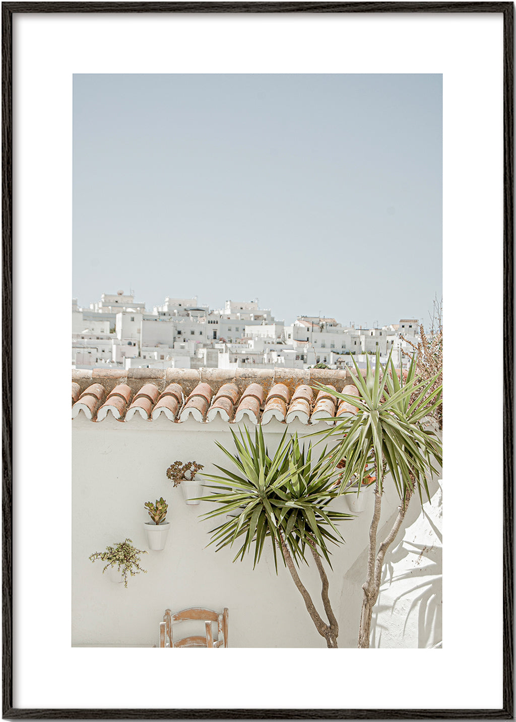 Landschapsposter met witte daken en yucca