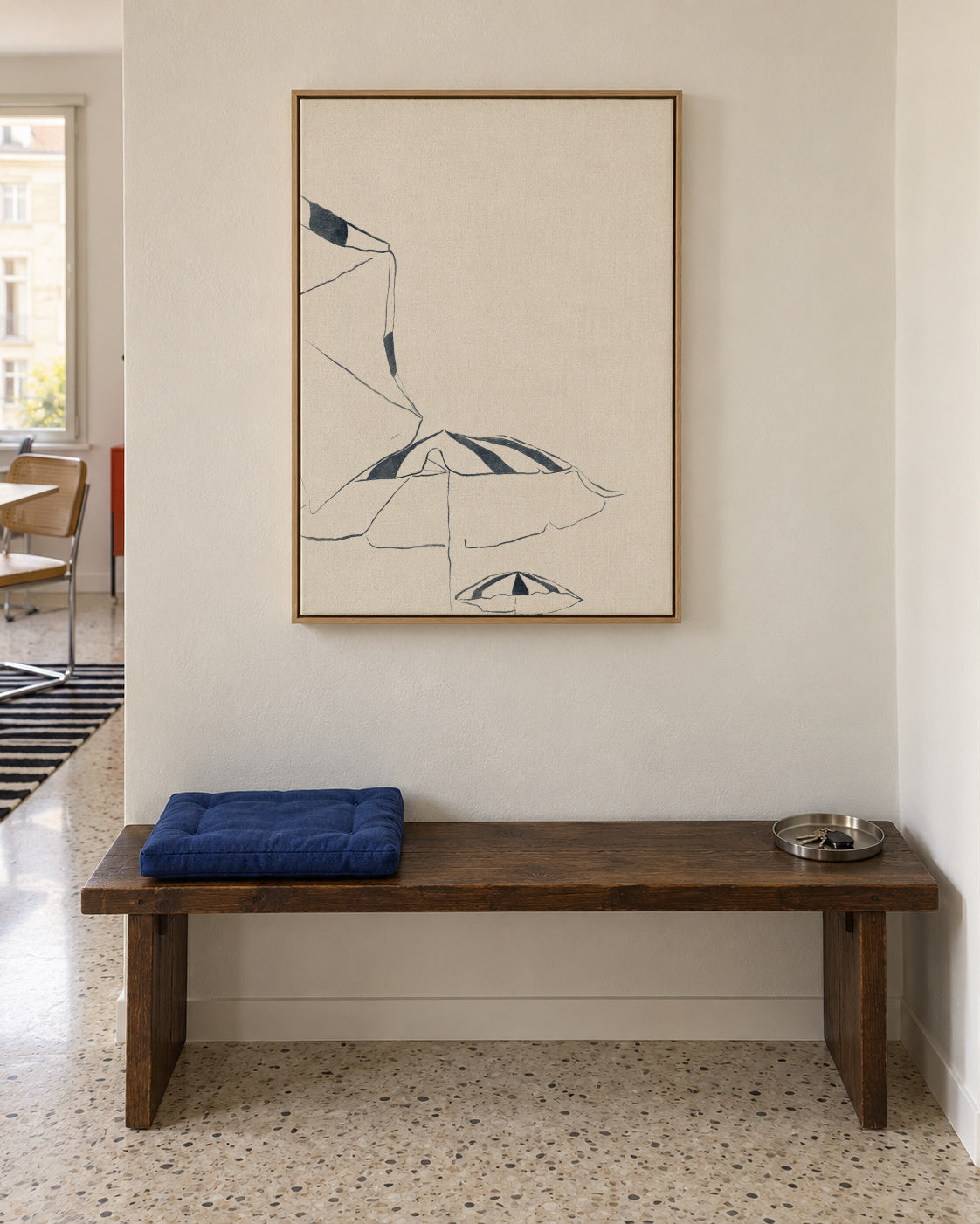 Blue Umbrellas - Framed canvas in an interior