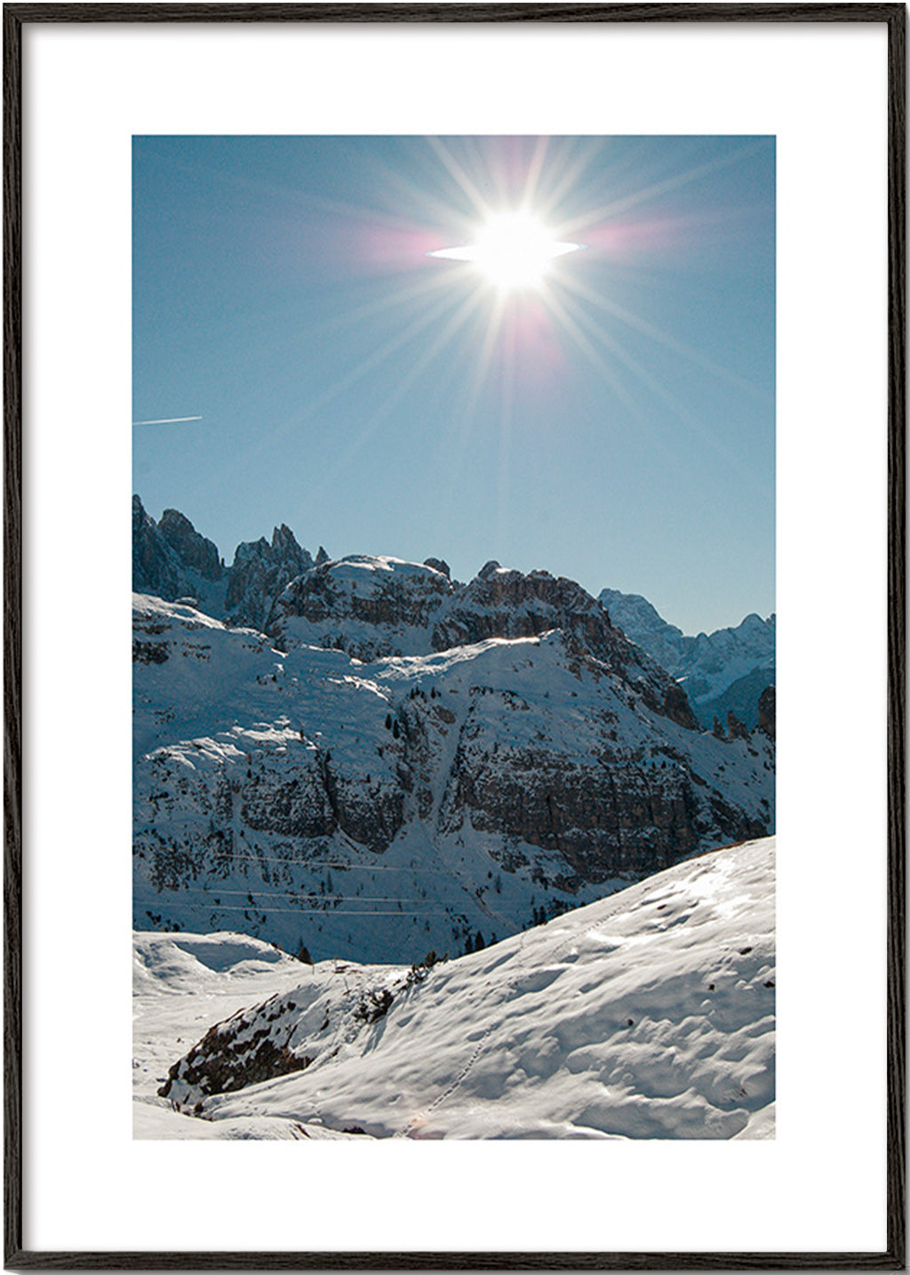 Landschapskunst: besneeuwde toppen onder felle zon