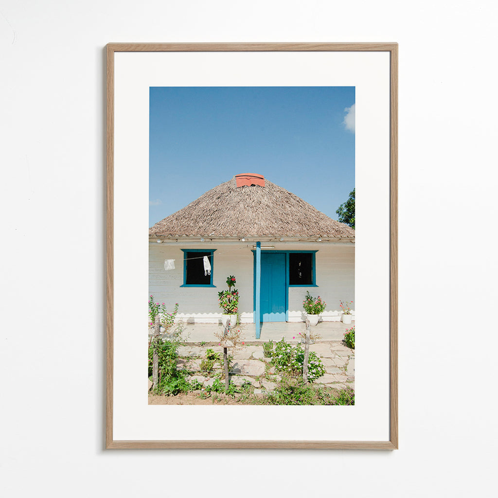 Landschap kunst: huisje met blauwe deur