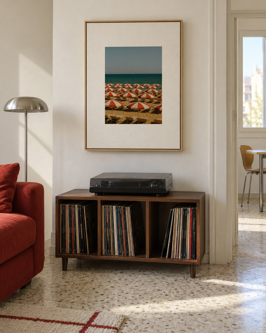 Red Umbrellas - Framed canvas in an interior