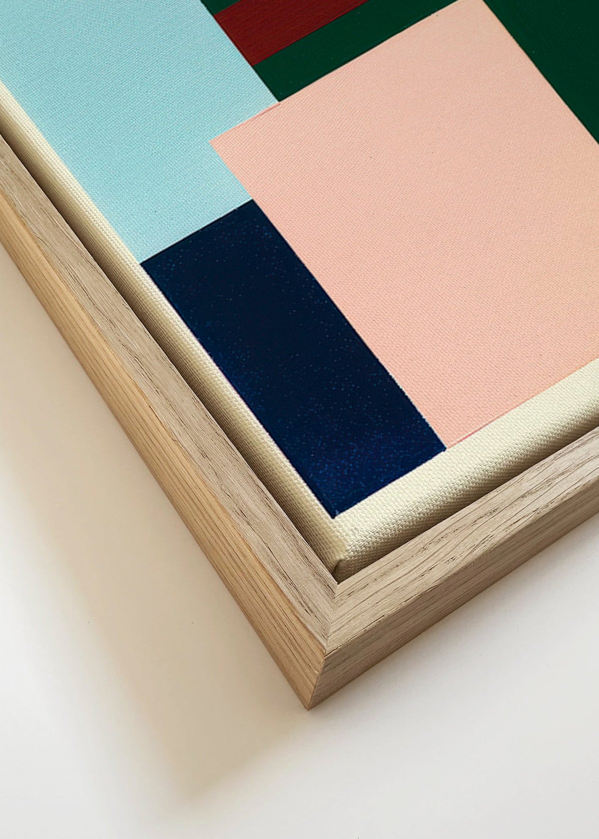 Geometrisch schilderij diep groen en zacht roze – Canvas detail